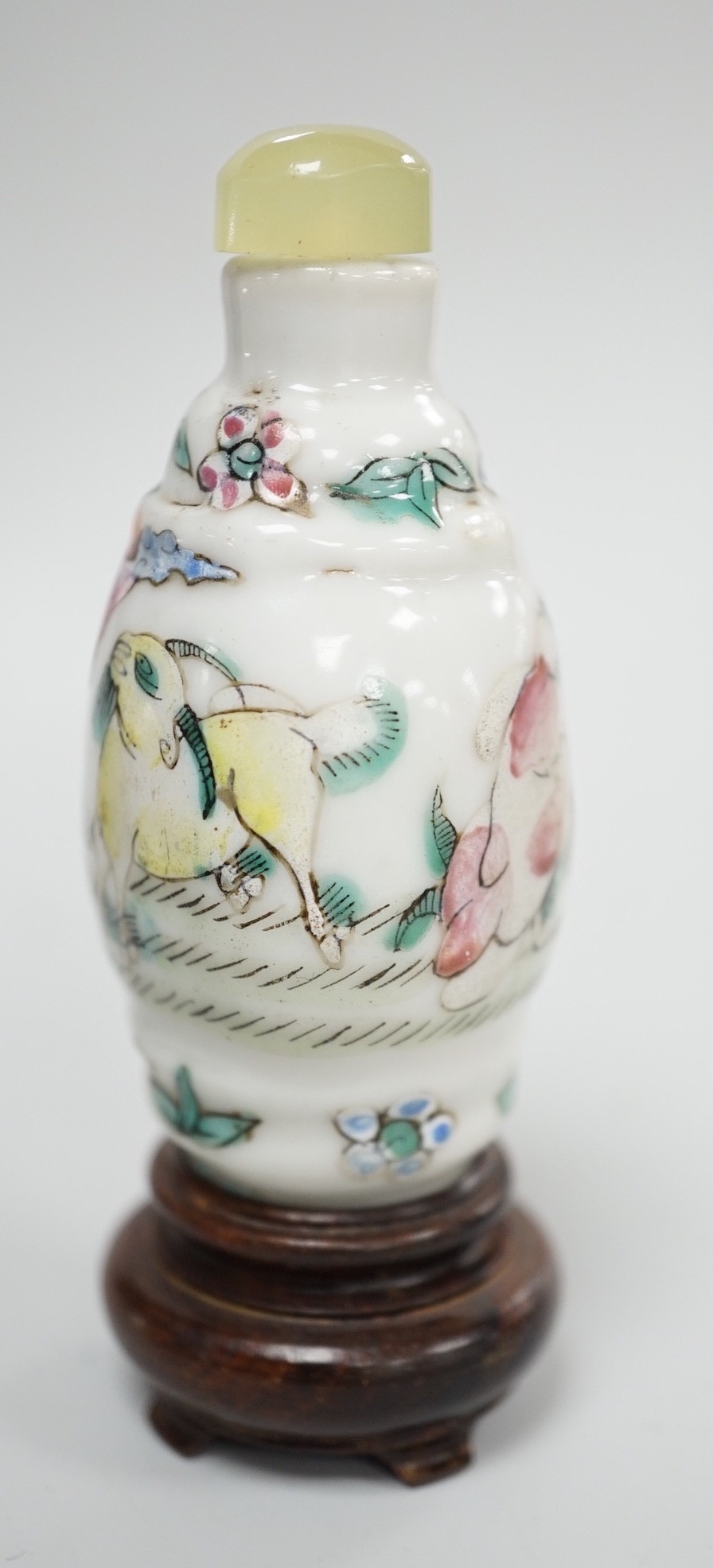 A Chinese famille rose snuff bottle, decorated with rams, Qianlong mark, 1850-1900, 6.7 cm high